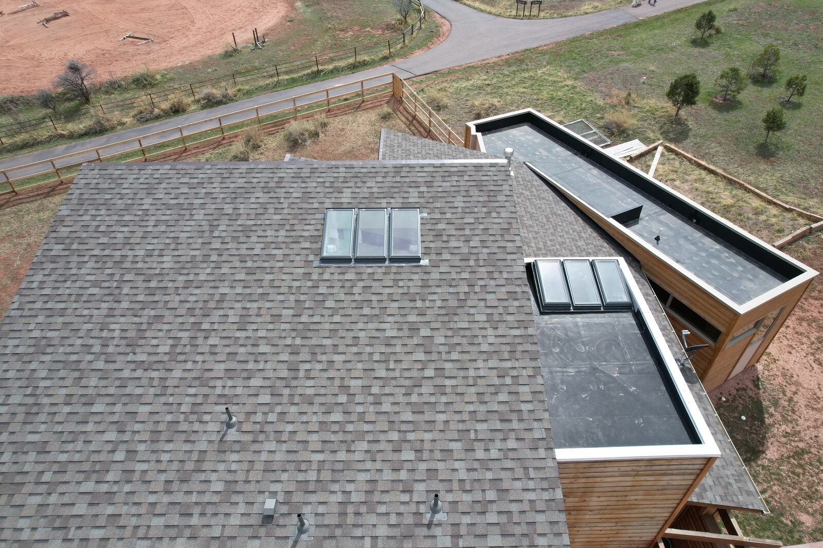 ARCM Roofing crew installing a new asphalt shingle roof on a home in Littleton, Colorado