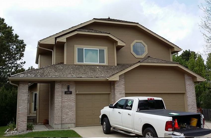 Soft wash roof cleaning removing stains from shingles