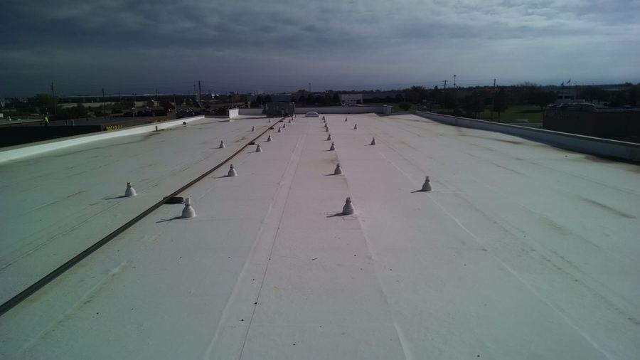 Flat TPO roof installation on a Denver commercial building