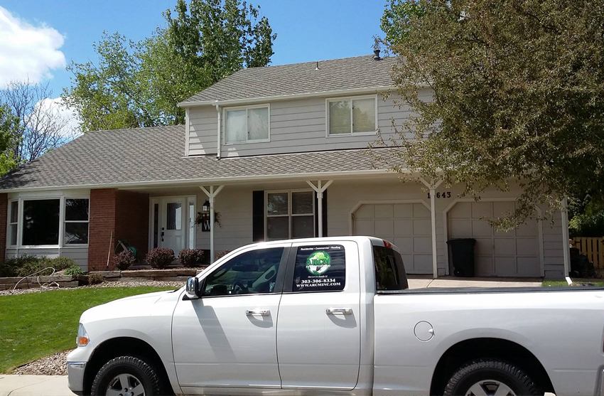 Emergency tarp installed on a storm-damaged residential roof